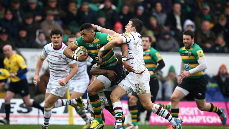 Luther Burrell of Northampton is tackled by Fergus Mulchrone of London Irish