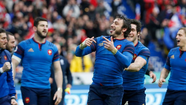 France full-back Maxime Medard (C) celebrates after scoring a try against Ireland