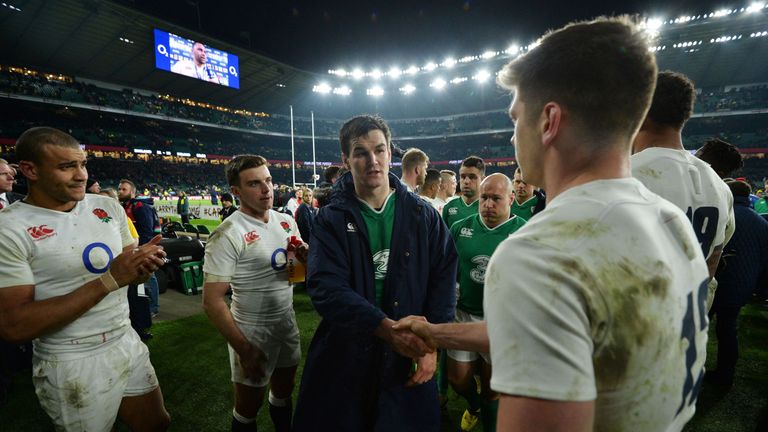 Owen Farrell (R) shakes hands with Johnny Sexton (C) after England's Six Nations win over Ireland