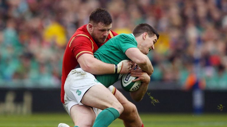 Wales prop Rob Evans tackles Ireland fly-half Johnny Sexton