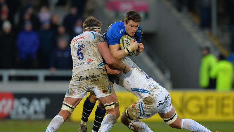 Sam James  of Sale Sharks tackled by Geoff Parling and Kai Horstmann of Exeter Chiefs