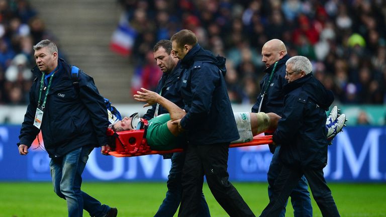 Ireland lock Mike McCarthy is stretchered off the pitch against France