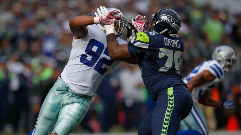 Jeremy Mincey #92 of the Dallas Cowboys battles tackle Russell Okung #76 of the Seattle Seahawks at CenturyLink Fi