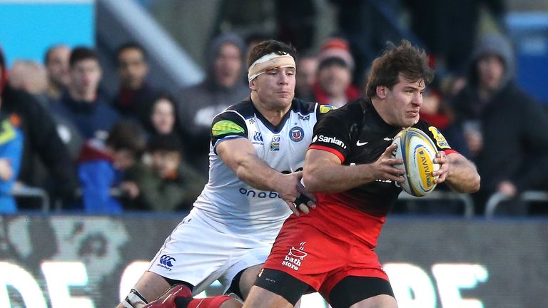 Schalk Brits of Saracens is held by Francois Louw during the Aviva Premiership match between Saracens and Bath at Allianz Park