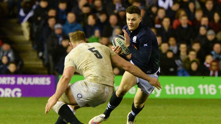 Scotland's Duncan Taylor (right) takes on George Kruis
