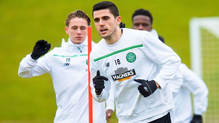 Scott Allan (l) watches on as Tom Rogic does some training on Monday