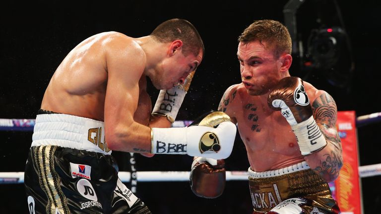Carl Frampton (R) and Scott Quigg in action