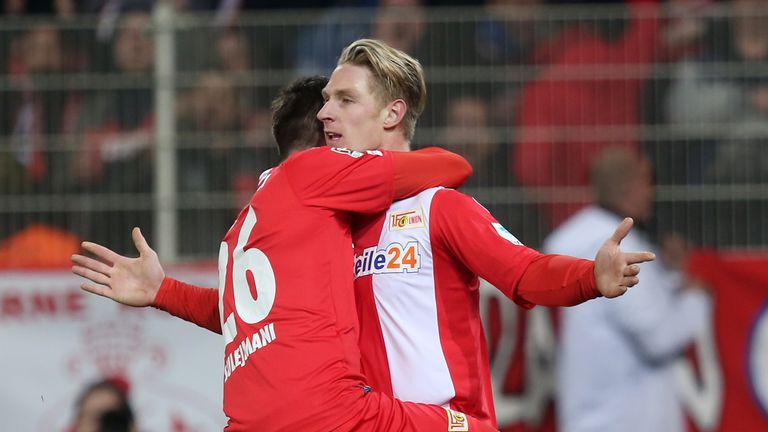 Sebastian Polter (R) with team-mate Valmir Sulejmani (L) after scoring  for 1.FC Union Berlin against FC St. Pauli on March 20, 2015