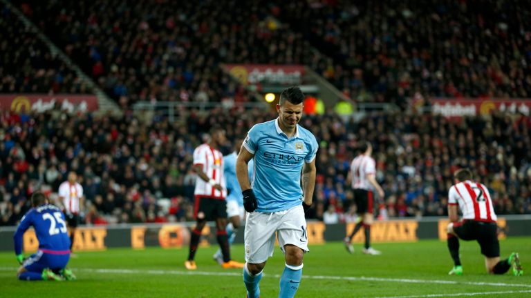 Manchester City's Sergio Aguero reacts to a knock incurred after scoring his side's first goal 