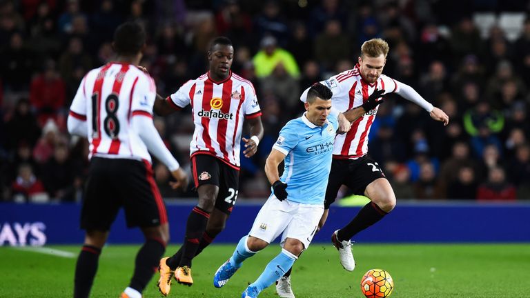 Sergio Aguero of Manchester City and Jan Kirchhoff of Sunderland compete for the ball