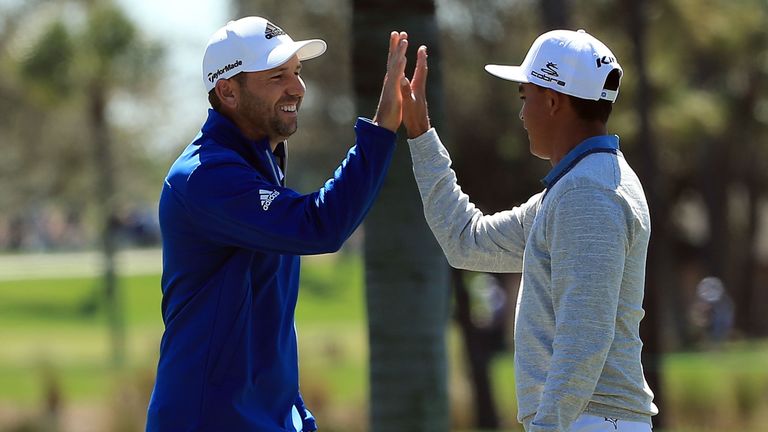 Sergio Garcia celebrates his 148-yard eagle with Rickie Fowler during the first round of the Honda Classic