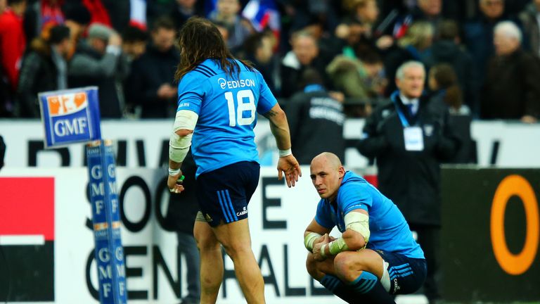 Italy's Sergio Parisse (right) is dejected after missing a last-gasp drop goal attempt against France.