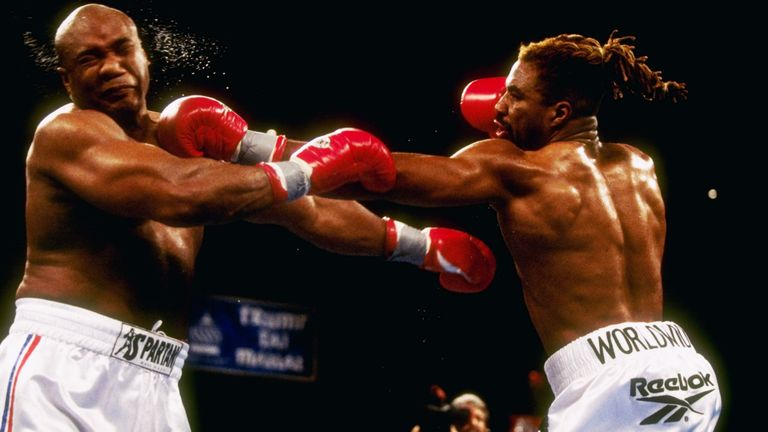 Shannon Briggs (right) hits George Foreman with a left jab during their bout at Mark Etess Arena in the Taj Mahal Hotel in Atlantic City, New