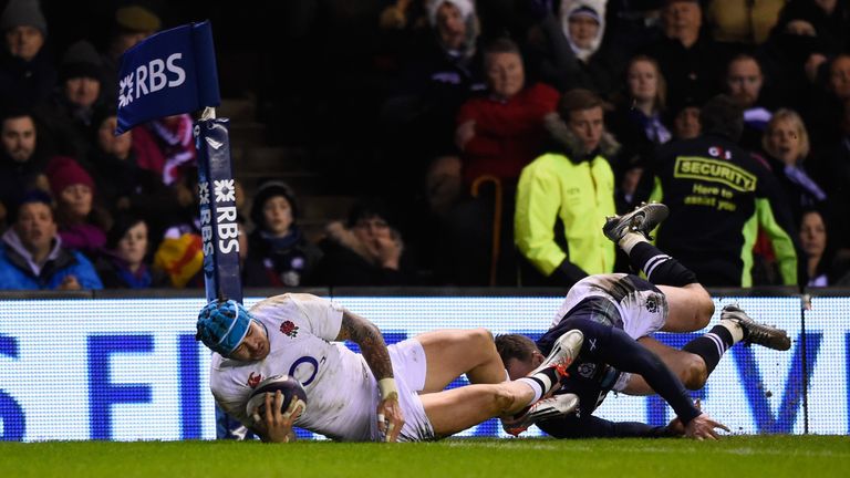 Jack Nowell of England dives over despite the tackle from Tommy Seymour of Scotland to score his team's second try  during the RBS Six Nations match