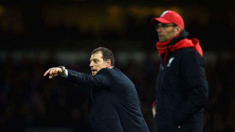 LONDON, ENGLAND - FEBRUARY 09:  Slaven Bilic manager of West Ham United signals as Jurgen Klopp manager of Liverpool looka on during the Emirates FA Cup Fo