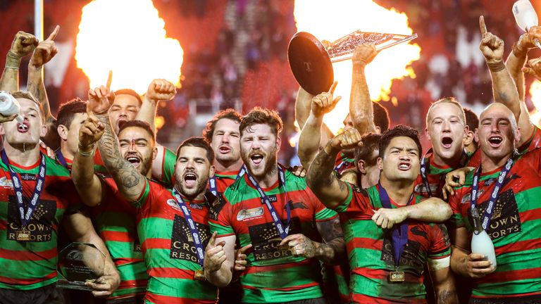 Rabbitohs' Greg Inglis and team-mates celebrate with the World Club Challenge trophy.