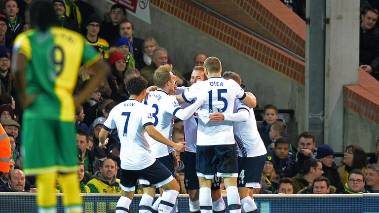 Tottenham Hotspur players celebrate their team's first goal by Dele Alli (obscured)
