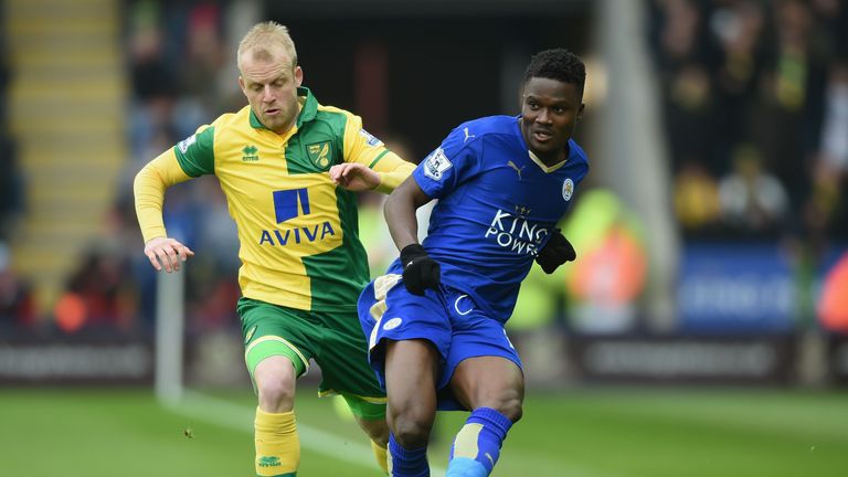 Daniel Amartey of Leicester passes the ball under pressure from Steven Naismith 