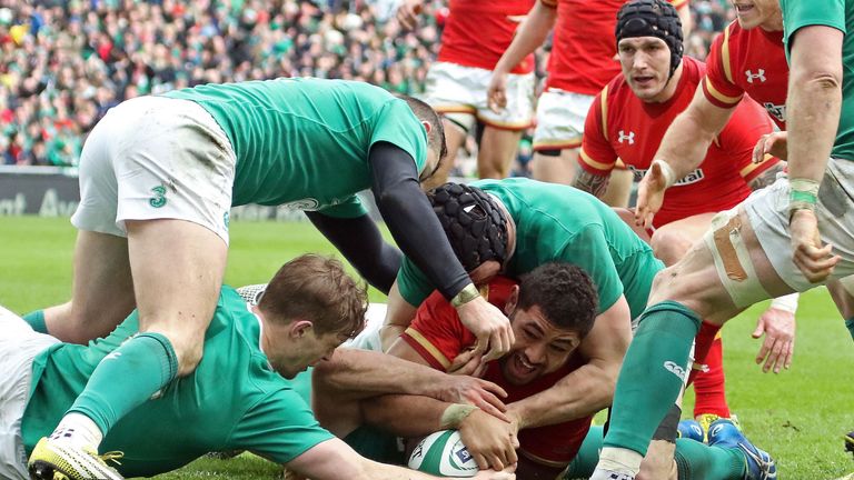 Wales No 8 Taulupe Faletau (C) scores his team's first try during the Six Nations match between Ireland and Wales at the Aviva Stadium