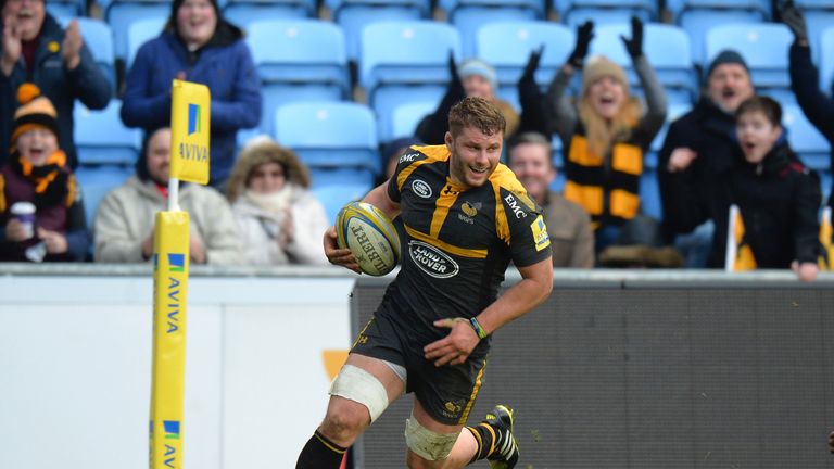 Thomas Young of Wasps runs in to score a try 