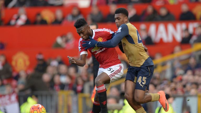 Manchester United's Dutch defender Timothy Fosu-Mensah (L) and Arsenal's Nigerian striker Alex Iwobi 