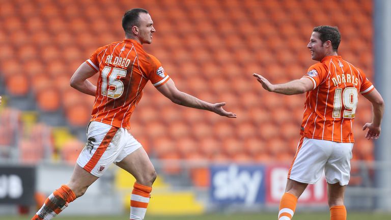 Blackpool's Tom Aldred (left) celebrates scoring against Shrewsbury Town with team mate David Norris