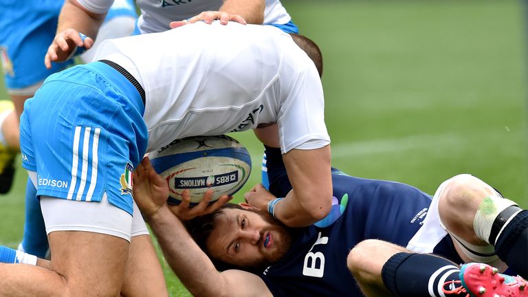 Scotland's Tommy Seymour (R) is tackled by Italy's Mattia Bellini during the Six Nations international rugby union 