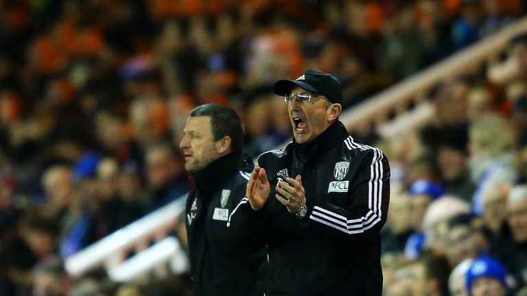 PETERBOROUGH, ENGLAND - FEBRUARY 10:  Tony Pulis, manager of West Bromwich Albion encourages his players from the touchline during the Emirates FA Cup four