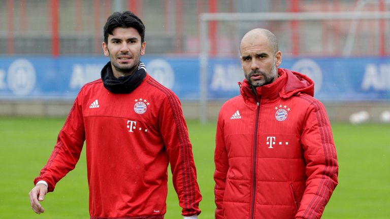 New signing Serdar Tasci alongside Bayern Munich coach Pep Guardiola on the training ground