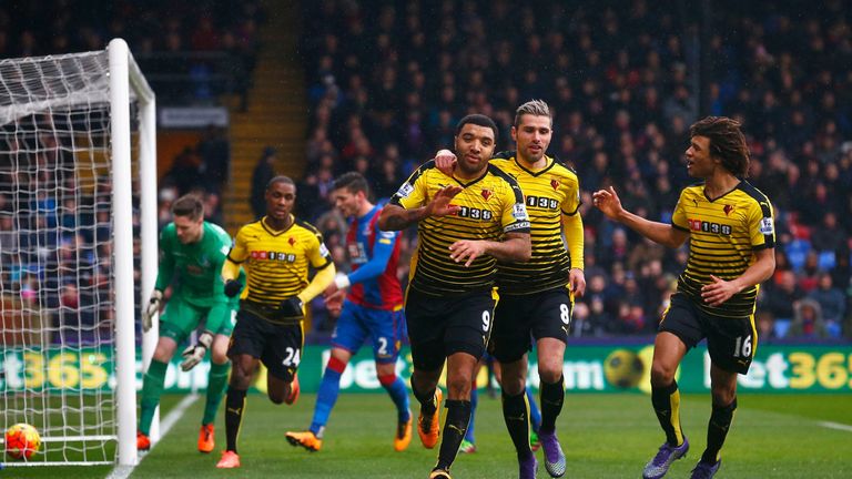 Troy Deeney(3rd R) of Watford celebrates scoring his team's first goal with his team mate Valon Berami (2nd R) and Nathan Ake 