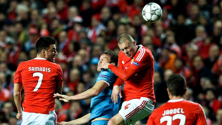 Benfica's Swedish defender Victor Lindelof (2R) heads the ball with Zenit's forward Artem Dzyuba