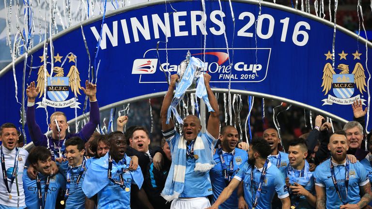 Manchester City's Vincent Kompany lifts the Capital One Cup at Wembley Stadium