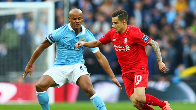 Philippe Coutinho is watched Vincent Kompany during the Capital One Cup final at Wembley