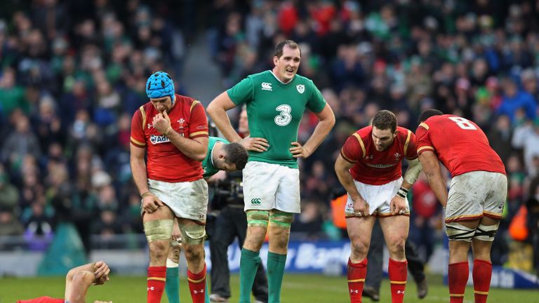 Exhausted players react as the final whistle blows on the 16-16 draw during the RBS Six Nations match between Ireland and Wales