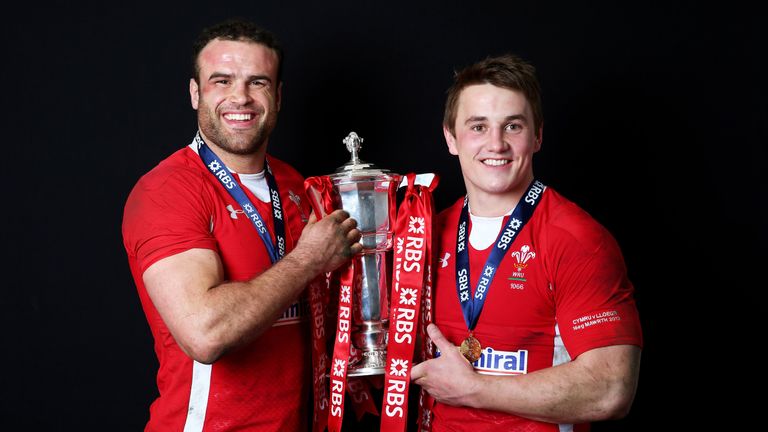 The Wales centre pairing of Jamie Roberts (L) and Jonathan Davies (R) pose with the trophy ahead of the 2013 Six Nations