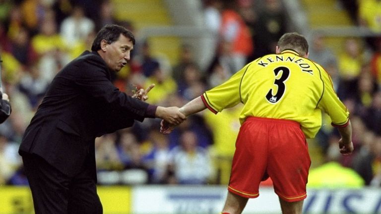 Graham Taylor speaks to Peter Kennedy during a Watford match against Chelsea