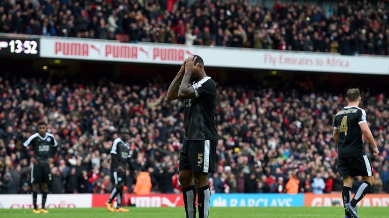 Wes Morgan and his Leicester team-mates react after Danny Welbeck scores for Arsenal 