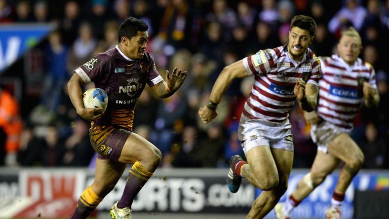 Anthony Milford of Brisbane Broncos gets past Anthony Gelling of Wigan Warriors 
