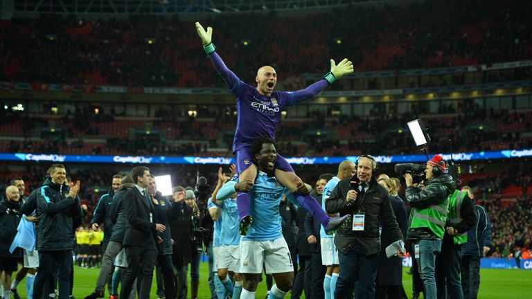 Willy Caballero is lifted up by Wilfried Bony following the Capital One Cup final penalty shootout