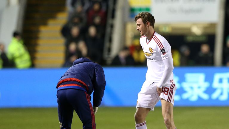 Manchester United's Will Keane receives treatment at Shrewsbury