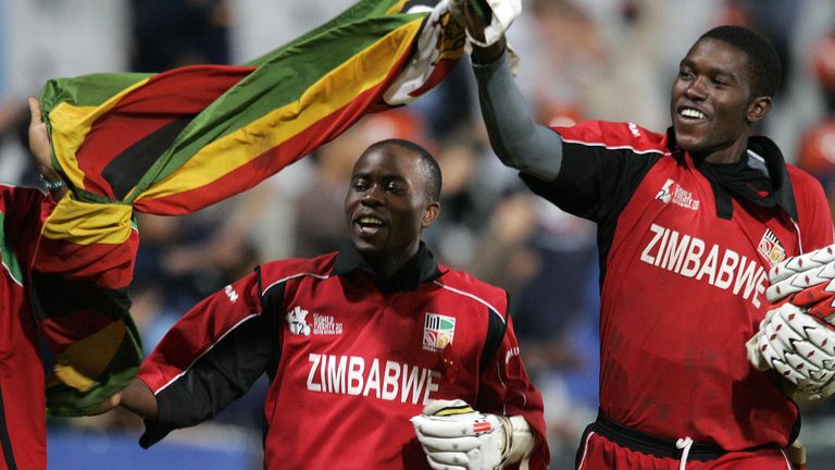 Zimbabwean cricket captain Prosper Utseya (L) and batsman Elton Chigumbura(R) celebrate 12 September 2007, their victory against Australia at the end of th