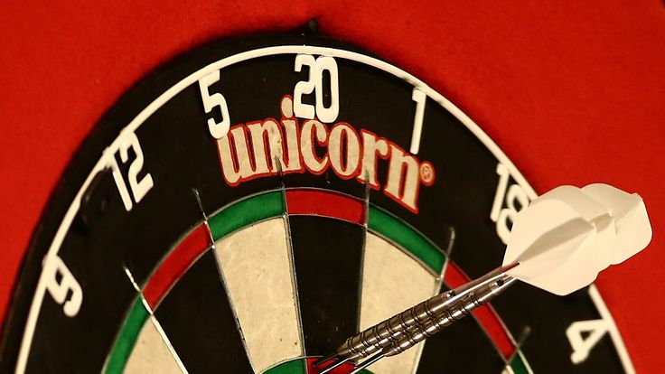 Darts scoring a 180 sit the board during Day Two of the William Hill PDC World Darts Championships at Alexandra Palace on D