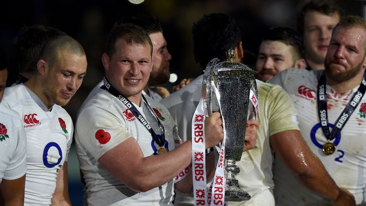 England's hooker and captain Dylan Hartley (2nd L) holds the trophy England celebrates winning the Six Nations 