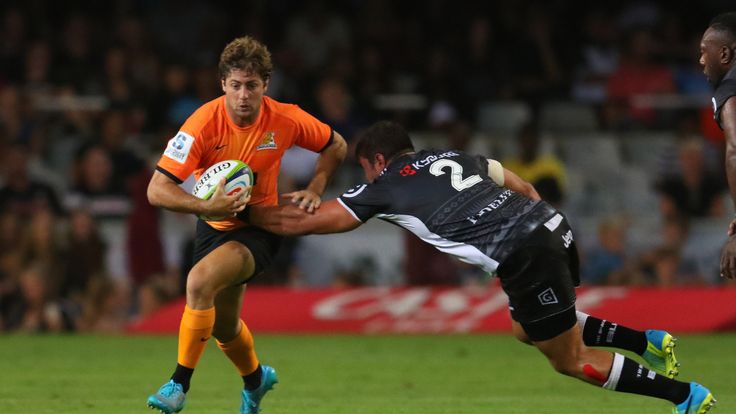 Sharks' Franco Marais (R) tackles Jaguares' Santiago Cordero (L) during the Super Rugby match between Sharks and Jaguares on March 5, 2016 in Durban