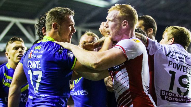 Wigan's Liam Farrell (right) clashes with Warrington's Ben Currie during the 2014 Super League play-offs