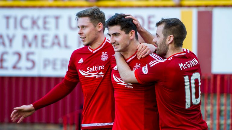 Kenny McLean (centre) celebrates after opening the scoring with a penalty for Aberdeen