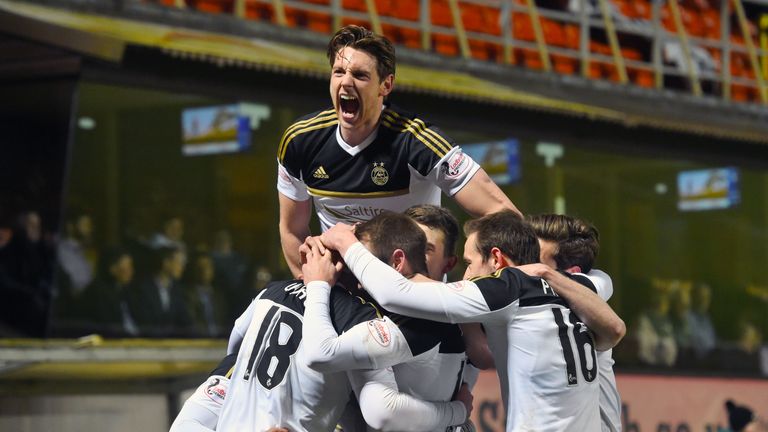 Aberdeen's Simon Church celebrates with teammates after scoring his side's goal
