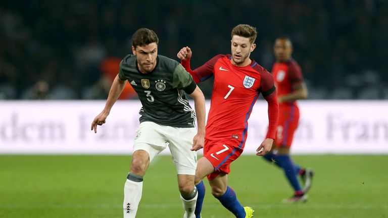 England's Adam Lallana and Germany's Jonas Hector battle for the ball