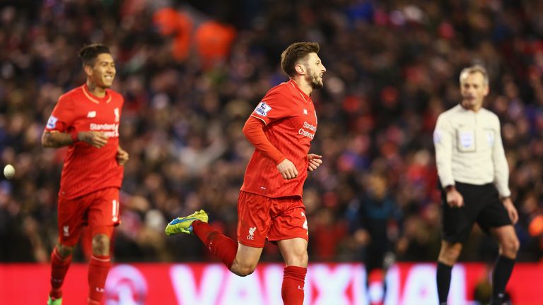 Liverpool's Adam Lallana celebrates after scoring against Manchester City