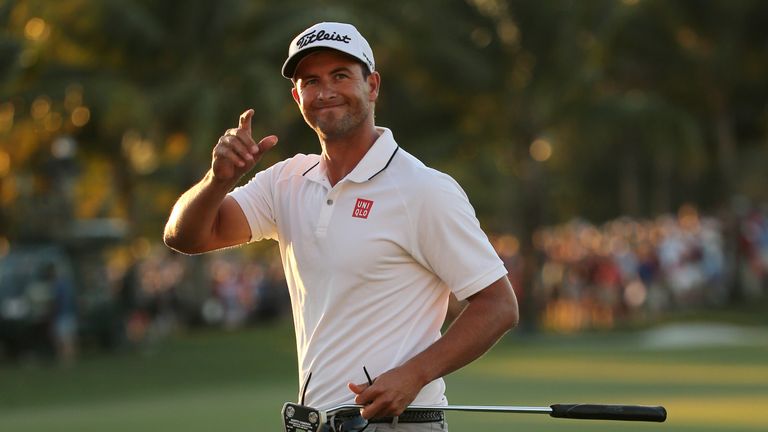 Adam Scott of Australia  reacts after putting in to win on the 18th hole during the final round of the World Golf Championships-Cadillac